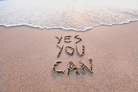 Strand med skrift i sanden Yes you can