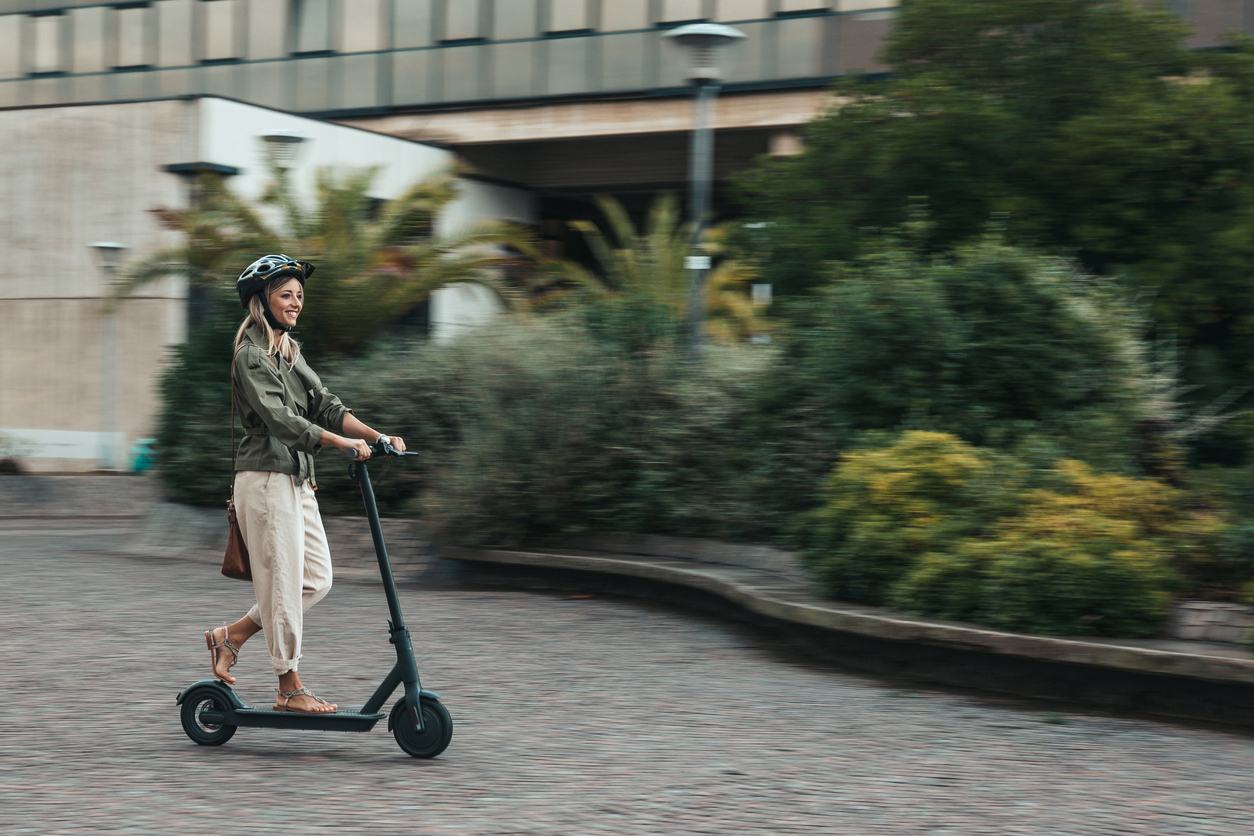 Green mobility in the city; woman commuting to work